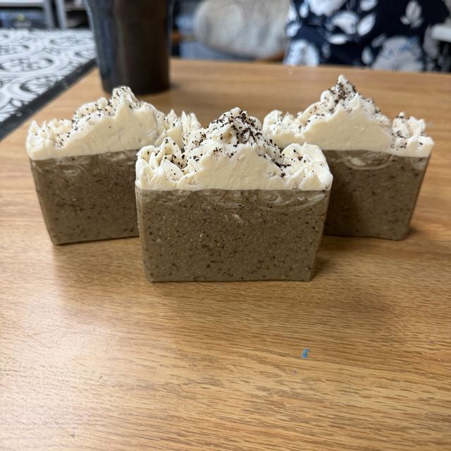 Original phone photo of three Barista Bar soaps on a workbench